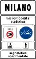Town sign: start of urban area where electric micromobility is being experimented (50&nbsp;km/h speed limit, no use of horn and particular caution to cyclists and motorized scooters)