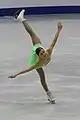 A basic outside edge spiral position with the free leg held unsupported behind the body