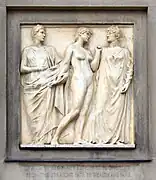 Justice, now adult, tempted, resists the pull of Wealth and raises her left arm defensively towards Fame.