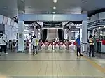 Fare gates at the LRT station concourse level.