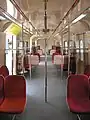 The (modified—with additional handle bars) interior of a Class 83 EMU train.