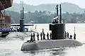 The Korean submarine Choi Museon makes its way past the United States Navy's USS&nbsp;Helena (Los Angeles class) and into the Sembawang port facilities in Singapore during Exercise PACIFIC REACH 2000.