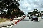 Cone taper for left lane closure in Western Australia showing small chevron (shifter), 40&nbsp;km/h repeater, chevron and arrow-board