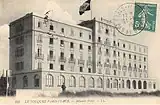 A stamped postcard with a hotel