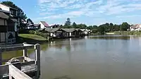 A lake with modern detached houses nearby