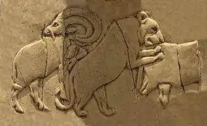 Lioness attacking a wild bull (Back, 4th register), another Mesopotamian motif.