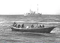 USFS&nbsp;Penguin (background) at anchor in the Bering Sea in 1939 while she unloads off St. George Island in the Pribilof Islands.