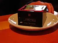 A decorated lacquer masu
