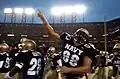Navy celebrates after winning the game