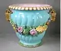 Coloured lead glazes majolica, flowers moulded in high relief. Shape first shown at the 1851 Exhibition by Minton & Co., Exhibit Number 60.