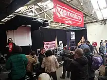 People gathered around a stage