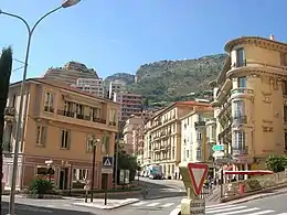 Lamarck Square, Les Moneghetti; this square contains, a garden, a post office, and a police station; the parish church (Sacred Heart) is 46 metres (50 yd) away.