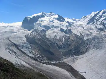2005: The connection between the Gorner Glacier and Grenzgletscher is still present and the moraine is still fed by the former; the old Monte Rosa Hut (2,795&nbsp;m) is recognizable above the left over, north-eastern lateral moraine of the Grenzgletscher (in the middle, right).
