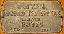 A brass boilerplate mounted on a wooden surface, and inscribed "Montreal Locomotive Works limited 53632 September 1913"