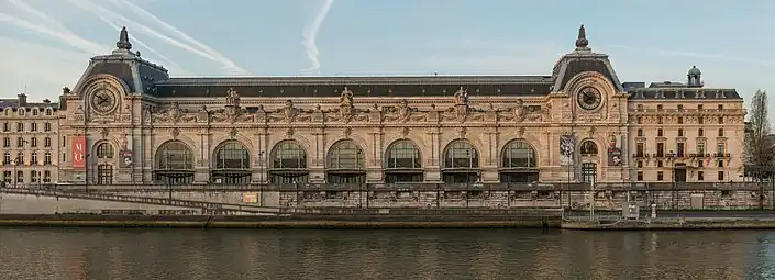 Beaux Arts Doric pilasters on the façade of the Gare d'Orsay, Paris, designed by Victor Laloux in c.1896-1897, and built in 1898-1900