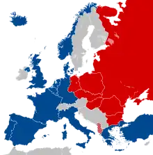A map of Europe showing several countries on the left in blue, and ones on the right are in red. Other unaffiliated countries appear in grey.