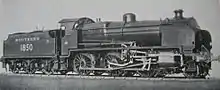 Official side view of a 2-6-0 locomotive against a white background. The distinguishing feature from normal N class locomotives is the experimental motion that powers the wheels.