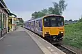 A Northern Class 150 waits at platform 2.