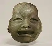 Ornamental mask; 10th century BCE; serpentine; height: 9.2&nbsp;cm, width: 7.9&nbsp;cm, depth: 3.2&nbsp;cm; Metropolitan Museum of Art (New York City)