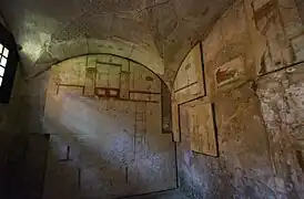 Room 5 of the House of the Painted Vaults. A wall painting of an erotic scene is on the south wall. 250 CE