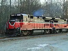 A pair of P&W diesel locomotives on a track. Exhaust can be seen from the lead locomotive, indicating it is on. The locomotives are numbered 4004 and 3907.