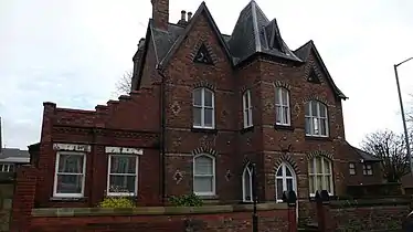 Park Lodge, an example of the neo-gothic style prevalent amongst houses along Rhosddu Road