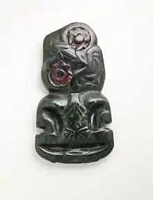 Hei-tiki; 18th century; nephrite and haliotis shell; 10.9 centimetres (4.3&nbsp;in); from the New Zealand; Los Angeles County Museum of Art (Los Angeles)