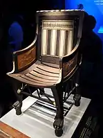 Ancient Egyptian armchair of Tutankhamun; 1336–1326 BC; wood, ebony, ivory and gold leaf; height: 71&nbsp;cm; Exposition of Tutankhamun Treasure in Paris (2019)