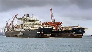 Carrying a 5,500&nbsp;t (6,100-short-ton) test platform in the bow slot (Aug 2016)