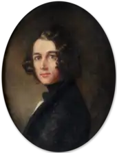 A man with shoulder-length black hair