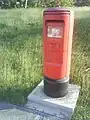 A post box in Barbados featuring the royal cypher of Queen Elizabeth II