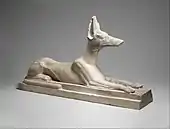 Recumbent Anubis; 664–30 BC; limestone, originally painted black; height: 38.1&nbsp;cm, length: 64&nbsp;cm, width: 16.5&nbsp;cm; Metropolitan Museum of Art