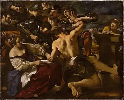 Samson Seized by the Philistines, 1619 This work showcases the biblical scene where Samson the Nazarite is betrayed by his lover Delilah. In the painting Samson is at the center, though his face cannot be seen, and surrounding him are the Philistines who have come to blind him after cutting off his hair, his source of strength. The men holding the tool that will be used to blind Samson can be seen as well as the man holding the scissors that had been used to cut Samson's hair. The figure in the righthand corner is interpreted to either be an angel looking on reminding Samson that his eventual sacrifice to save the Hebrews is right and seen in a good light by God or as an onlooker who was fleeing the scene but could not help from looking back.