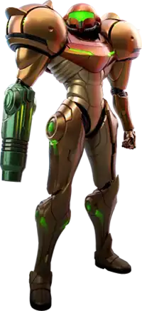 A person in a big, futuristic-looking powered suit with a helmet. The right arm is a large firearm. The shoulders are particularly large, bulky, and rounded.