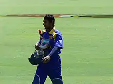 A man wearing blue Sri Lankan jersey