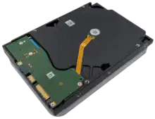 This image shows an oblique view of the back of a Seagate EXOS X18 18 TB HDD