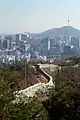 View of the Downtown Seoul and N Seoul Tower behind the Seoul City Wall