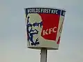KFC bucket sign proclaims "World's First KFC on State Street and 3900 South in Salt Lake County, Utah (January 2020)