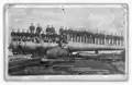 Soldiers standing on the 16-inch gun M1895 at Sandy Hook Proving Ground, New Jersey