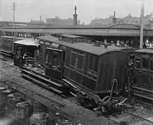 The aftermath of the 1898 St Johns rail accident, where the rear two carriages of a passenger train were telescoped by being hit at 8&nbsp;mph (13&nbsp;km/h) by a following train.