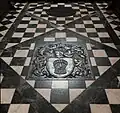 Floor of the chancel with  Grosvenor arms
