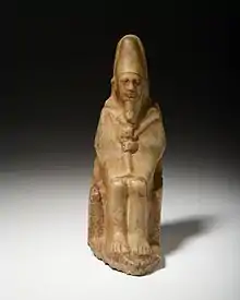 Quartzite statue of Nynetjer wearing ceremonial clothes of the sed festival, Rijksmuseum van Oudheden.
