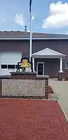 The town hall in Stilesville, Indiana, with a memorial for the old school.