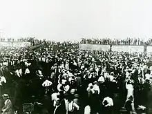 Photo of the crowd exploring the wreckage.