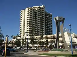A high rise hotel building photographed from the ground