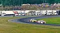 GT3 cars battle through "The Left Hander", turn 3, headed up towards Paul Newman Straight during an IMSA event at Lime Rock Park