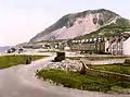 Colourised Photochrom print (circa the late 19th century) of seafront and Penmaenmawr mountain