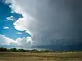 A thundercloud rolling in over the prairie.
