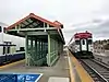 Two trains at an elevated railroad station