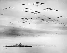 Huge formation of American planes over USS Missouri and Tokyo Bay celebrating the signing, 2 September 1945